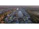 Expansive aerial view of a community showcasing mature trees, landscaping and a peaceful lake at 5424 Frederick Lake Dr, Port Orange, FL 32128