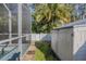 Backyard featuring a screened pool area, storage shed, and lush landscaping at 5424 Frederick Lake Dr, Port Orange, FL 32128