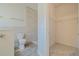 Bathroom with a toilet, walk-in shower and walk-in closet at 5424 Frederick Lake Dr, Port Orange, FL 32128
