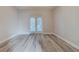 Bedroom with a French door leading to the backyard and wood-look flooring at 5424 Frederick Lake Dr, Port Orange, FL 32128