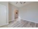 Bedroom featuring light gray walls, wood-look flooring, and a ceiling fan at 5424 Frederick Lake Dr, Port Orange, FL 32128