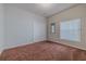 Bedroom with brown carpet, double closet, and window with blinds at 5424 Frederick Lake Dr, Port Orange, FL 32128