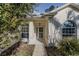 The home's entryway, showing the front door, porch, and partial front yard at 5424 Frederick Lake Dr, Port Orange, FL 32128