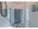 Inviting entryway with chandelier, mirror, and stylish front door at 5424 Frederick Lake Dr, Port Orange, FL 32128