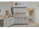 Bright kitchen with sink and faucet, light cabinets and countertops and wood floors at 5424 Frederick Lake Dr, Port Orange, FL 32128