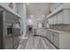 Modern kitchen with stainless steel appliances and white cabinets at 5424 Frederick Lake Dr, Port Orange, FL 32128