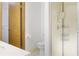 Bathroom with a small toilet, sink, and stand up shower plus a door leading to a closet at 55 Bay Harbour Dr, Ponce Inlet, FL 32127