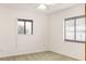 Bright bedroom with two windows and neutral carpet at 55 Bay Harbour Dr, Ponce Inlet, FL 32127