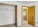 Bedroom showing closet doors, carpeted floors, an open doorway and neutral colored walls at 55 Bay Harbour Dr, Ponce Inlet, FL 32127