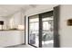 Bright dining area has sliding doors that open to screened lanai and pool at 55 Bay Harbour Dr, Ponce Inlet, FL 32127