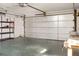 Spacious garage with ample room for parking and a workbench, providing functional workspace at 55 Bay Harbour Dr, Ponce Inlet, FL 32127