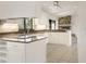 Modern kitchen featuring white cabinets and stainless steel appliances at 55 Bay Harbour Dr, Ponce Inlet, FL 32127