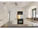 Well-lit kitchen features white cabinets, modern appliances, and dark countertops at 55 Bay Harbour Dr, Ponce Inlet, FL 32127