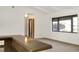 Bright living room with large windows and a breakfast bar at 55 Bay Harbour Dr, Ponce Inlet, FL 32127