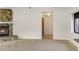 Bright living room featuring a stone fireplace at 55 Bay Harbour Dr, Ponce Inlet, FL 32127