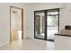 Open floor plan with tile floors and sliding glass doors to the pool area at 55 Bay Harbour Dr, Ponce Inlet, FL 32127