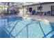Screened-in pool area offers a perfect setting for outdoor relaxation and entertaining with ample seating at 55 Bay Harbour Dr, Ponce Inlet, FL 32127