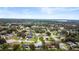 Scenic aerial view of the property located in a leafy neighborhood, showing its setting near community amenities at 6046 Burgundy Ter, Port Orange, FL 32127