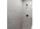 The shower is tiled and contains a brushed nickel shower head and faucet at 6046 Burgundy Ter, Port Orange, FL 32127