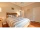 Cozy bedroom features neutral tones, natural light, and a wood-look flooring at 6049 Sabal Hammock Cir, Port Orange, FL 32128