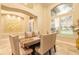 Refined dining room featuring 6 upholstered chairs, tray, and natural light through windows at 6049 Sabal Hammock Cir, Port Orange, FL 32128