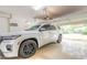 Clean garage with a late-model SUV parked inside and access to the home and driveway at 6049 Sabal Hammock Cir, Port Orange, FL 32128