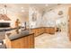 Well-appointed kitchen with granite counters, modern appliances, and seamless flow to other living spaces at 6049 Sabal Hammock Cir, Port Orange, FL 32128