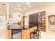 Modern kitchen with sleek cabinetry, granite countertops, and stainless steel appliances at 6049 Sabal Hammock Cir, Port Orange, FL 32128