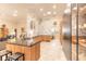 Spacious kitchen featuring modern cabinetry, marble backsplash, and an open layout at 6049 Sabal Hammock Cir, Port Orange, FL 32128