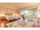 Relaxing main bedroom with a king bed, ceiling fan, and sliding glass doors to the lanai at 6049 Sabal Hammock Cir, Port Orange, FL 32128