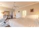 Spacious main bedroom boasts a king-size bed, ceiling fan, and plenty of natural light at 6049 Sabal Hammock Cir, Port Orange, FL 32128