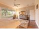Bright main bedroom offering lanai access, hardwood floors, ceiling fan, and neutral colors at 6049 Sabal Hammock Cir, Port Orange, FL 32128