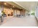 Expansive screened patio with comfortable seating overlooks the kitchen and dining area at 6049 Sabal Hammock Cir, Port Orange, FL 32128