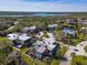 Aerial view of townhomes near a lake with dock at 61 Cedar Dunes Dr, New Smyrna Beach, FL 32169