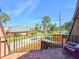 Balcony with great views of palm trees and neighborhood at 61 Cedar Dunes Dr, New Smyrna Beach, FL 32169