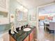 Bathroom featuring laundry closet, decorative mirror, stylish fixtures, and a sink at 61 Cedar Dunes Dr, New Smyrna Beach, FL 32169