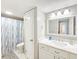 Bathroom featuring a large vanity with a single sink and tub/shower combo at 61 Cedar Dunes Dr, New Smyrna Beach, FL 32169