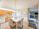 Open kitchen featuring an island with seating, stainless steel appliances, and a view into the living area at 61 Cedar Dunes Dr, New Smyrna Beach, FL 32169