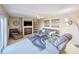 Cozy living room featuring a comfortable sofa, fireplace, ceiling fan, and sliding door to the outside at 61 Cedar Dunes Dr, New Smyrna Beach, FL 32169