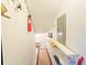 Storage space featuring sloped ceiling, wall shelves, and hanging fire extinguisher at 61 Cedar Dunes Dr, New Smyrna Beach, FL 32169