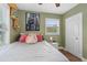 Inviting bedroom with a ceiling fan, hardwood floors, and plenty of natural light at 612 Cedar Park Dr, Daytona Beach, FL 32114