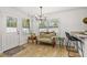 Bright and airy dining area with a modern chandelier and natural light at 612 Cedar Park Dr, Daytona Beach, FL 32114
