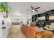 Spacious living room with tile floors, a ceiling fan, and built in shelving at 612 Cedar Park Dr, Daytona Beach, FL 32114