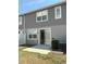 Backyard patio with a sliding glass door to the home's interior at 612 Mount Olympus Blvd, New Smyrna Beach, FL 32168