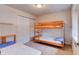 Bedroom showcasing bunk beds and a twin bed, perfect for children or guests at 612 Mount Olympus Blvd, New Smyrna Beach, FL 32168