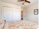 Bedroom featuring a ceiling fan, large closet, and a decorative bedspread at 612 Mount Olympus Blvd, New Smyrna Beach, FL 32168