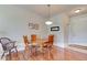 Dining area with a round table, a decorative light fixture, and easy access to the main door at 612 Mount Olympus Blvd, New Smyrna Beach, FL 32168