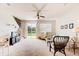 Bright living room with a ceiling fan, lots of natural light, and a sliding glass door to the outside at 612 Mount Olympus Blvd, New Smyrna Beach, FL 32168
