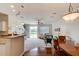 Spacious, open-concept living area connecting the kitchen, dining, and living spaces at 612 Mount Olympus Blvd, New Smyrna Beach, FL 32168