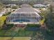 An aerial view of the property showcasing the screened-in pool and spacious backyard at 6456 Cypress Springs Pkwy, Port Orange, FL 32128